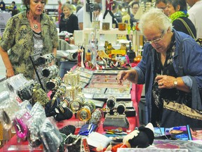 A customer takes a glimpse at some vintage items as the Portage Terriers Ladies Auxiliary club held their annual flea market at the Portage Curling Club Sept. 8. (Kevin Hirschfield/THE GRAPHIC/QMI AGENCY)