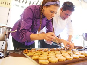 Amanda Green and Adam Martin of Windmills restaraunt prepare their contribution to Sunday's United Way Fare for Friends. (Elliot Ferguson/The Whig-Standard)