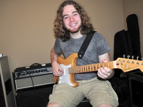 Fanshawe College student and local musician Jesse Hildebrand-Nestor with his Fender Stratocaster August 28, 2013. Hildebrand-Nestor and his farther, James Nestor, founded the annual Wish You Were Here benefit concert. The third iteration of the event, a fundraiser for prostate cancer research, takes places at the Grand Theatre October 5, 2013. CHRIS MONTANINI\LONDONER\QMI AGENCY