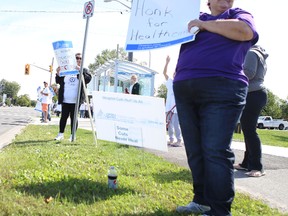 OPSEU members picket in front of Providence Care Monday to protest job cuts at the facility and the private sector involvement in the building of a new hospital.
Elliot Ferguson The Whig-Standard
