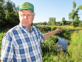 John La Forge of Marshall, Mich., points to a portion of Talmadge Creek which in 2010 was covered in oil after a pipeline, owned by Enbridge Pipelines, ruptured. 
Paul Schliesmann/The Whig-Standard