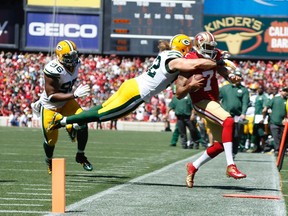 Packers linebacker Clay Matthews (52) commits a late hit on 49ers QB Colin Kaepernick (7) during second quarter NFL action in San Francisco, Sunday, Sept. 8, 2013. (Stephen Lam/Reuters)