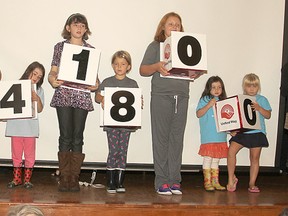 Youngsters turn over their blocks to announce the new fundraising goal during Tuesday morning's kick-off breakfast for the 2013 United Way campaign.
Michael Lea The Whig-Standard