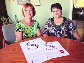 Rhonda Hallberg and Susan Dill of Women's Community House with posters for the Stories of Courage to Change project at Women's Community House on Wellington Street Sept.6, 2013. The project, part of the organization's 35th anniversary celebrations, aims to collect stories of women who received help from the group to make positive changes in their lives. SHOBHITA SHARMA/LONDONER/QMI AGENCY