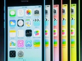 The five colors of the new iPhone 5C are seen on screen at Apple Inc's media event in Cupertino, Calif., Sept. 10, 2013. REUTERS/Stephen Lam