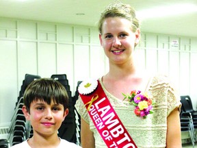 Lambton Queen of the Furrow Jen Vanden Ouweland presents Mathew Sterling, 10, of Chatham-Kent with the award for the Best Land Plowed by a junior at this year’s Lambton County Plowing Match.