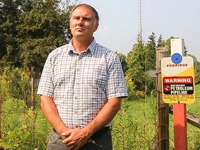 Paul MacLatchy, the City of Kingston’s director of environment and sustainable initiatives, stands near a sign pointing out the area of and Enbridge pipeline, which runs through the rural north end of the city.
Sam Koebrich/The Whig-Standard