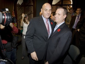 George Smitherman and his husband Christopher Peloso are seen in this November 2009 file photo. (Toronto Sun files)