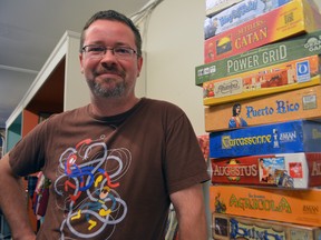 Chris McInnis of Über Cool Stuff at the Clarence Street located store Sept. 10, 2013 in London, Ont. McInnis is bringing the Great Canadian Game Blitz to London Sept. 21. The eight-hour board game marathon will take place at Chaucer’s Pub in support of Project Play. SHOBHITA SHARMA/LONDONER/QMI AGENCY
