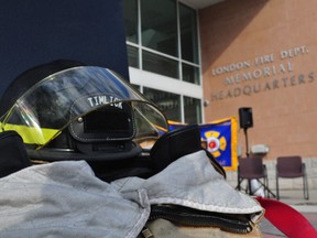 Fire fighting gear placed next to a monument dedicated to London’s fallen firefighters at the London Fire Department Memorial Headquarters on Horton Street September 11, 2013. A remembrance service was held that day — the anniversary of the 2001 terrorist attacks in New York and Washington D.C. — to remember firefighters who have died in the line of duty.   CHRIS MONTANINI\LONDONER\QMI AGENCY