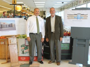 Eastalta Co-op General Manager Gerald Hiebert (left), and Dwight Miller, President of the Eastalta Co-op board of directors, pose beside pictures of the new building plan, slated to break ground Spring 2014.