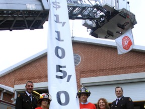 From left to right: Scott Tegler, Woodstock Fire Chief, United Way Oxford campaign co-chairs Kristi Cross and Chris Friesen, Kelly Gilson, executive director of United Way Oxford and Dept. Fire Chief Brian Arnold are seen above at the United Way Oxford kick-off breakfast on Thursday morning where they announced this year's campaign goal of $1,105,000. (CODI WILSON/ Sentinel-Review)