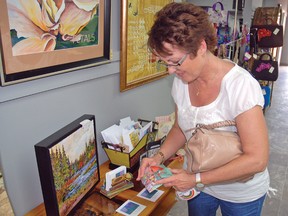 Susie Hunt, from Stavely, made her way to the Healy Heritage Art Centre, which is the new home of the Nine in a Line Creative Arts Society of Vulcan, during its official opening at the Vulcan centennial. The building is located on Centre Street at the location of the former piano museum.