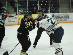 London Knights prospect Chris Maton, left, tussles with Plymouth Whalers winger Connor Sills late in the third period of a preseason game at the Timken Centre in St. Thomas on Saturday, Sept. 14, 2013. London lost 5-1 in a game that raised funds for the St. Thomas Minor Hockey Association. Ben Forrest/QMI Agency/Times-Journal