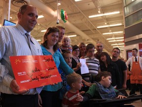 The Klyn family and the Masters family both received donations from the President's Choice Children's Charity at Zehrs in Woodstock on Saturday morning. CODI WILSON/ Sentinel-Review