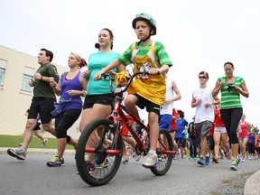 Runners, walkers and cyclists hit the streets for the 33rd Terry Fox Run Sunday at St. Lawrence College. (Elliot Ferguson/The Whig-Standard)