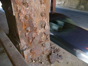 Corrosion takes its toll on a support for rail tracks over the Ross St. subway.