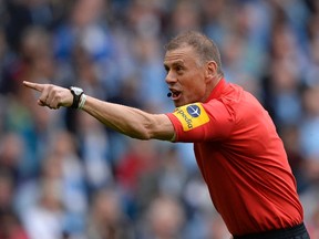Referee Mark Halsey gestures during the English Premier League soccer match between Manchester City and Norwich City in Manchester, May 19, 2013. (REUTERS/Nigel Roddis)