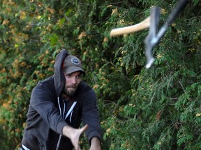 Lee Coates lets fly with an axe during the Huron County Chuckers' Saturday practice.