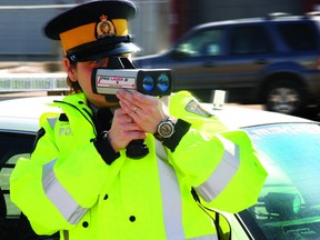 FILE PHOTO: Const. Christina Wilkins of the Wood Buffalo RCMP demonstrates the precise accuracy of the laser in identifying the speed of vehicles around town Tuesday. AMANDA RICHARDSON/QMI Agency