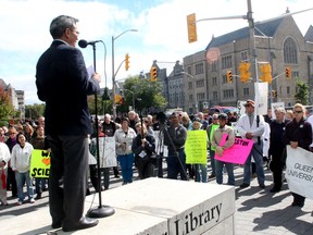 Kingston and the Islands MP Ted Hsu speaks to a Stand up for Science rally outside Queen's University's Stauffer Library on Monday. (Ian MacAlpine The Whig-Standard)