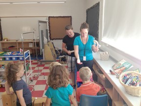 Brookside Public School teacher Jeannine Elston and early childhood educator Kerri Murray interact with kindergarten students last Wednesday. This is the first year for full day, every day, Kindergarten at Brookside.