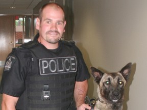 File photo of Cst. Rick Bertok with his canine partner Arry.