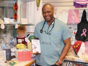 Dr. Donovan Gray with copies of his book Dude Where's My Stethoscope? at Aline's Boutique in Lady Minto Hospital during his last locum in July.