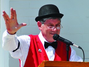 Wolfe's Home Hardware also celebrated its 100th birthday during Vulcan's centennial celebration in August. Here, owner Randy Wolfe does the Vulcan salute during a brief speech during the business's celebration. Stephen Tipper Vulcan Advocate