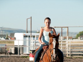 Jessica Quinn takes part in the Piikani youth riding program. Quinn took her noble steed ‘Tuffy’ through the paces during the program, learning the finer points of barrel racing. Bryan Passifiume photo/QMI Agency