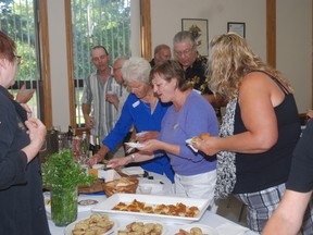 Guests at a West Elgin Chamber of Commerce Business After 5 sample food prepared by the Black Dog Village Pub and Bistro which will be opening a second location in the future Seaside development in Port Glasgow.