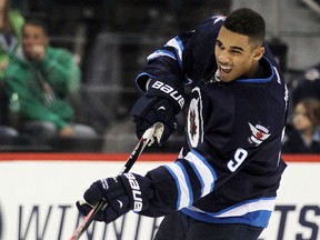 Evander Kane, shown here taking shooting practice before Tuesday's game against the Oilers, would like to see some post-season action. (Brian Donogh, QMI Agency)