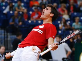 Canada’s Milos Raonic celebrates his victory over Serbia’s Janko Tipsarevic in the Davis Cup semifinal September 13, 2013 in Belgrade. (REUTERS/Marko Djurica)