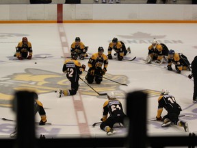 Players stretched at center ice on the first day of Sarnia Sting training camp. The roster has been set and the team opens up the OHL regular season Friday night against the Oshawa Generals at 7:05pm. SHAUN BISSON/ THE OBSERVER/ QMI AGENCY