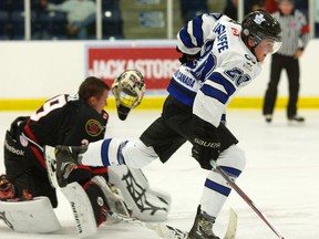 Sarnia Legionnaires goaltender Sean Parker?s mask was knocked off by Keaton Ratcliffe of the London Nationals when Parker came out of his crease to play a loose puck during their Greater Ontario Junior Hockey League game Wednesday at the Western Fair Sports Centre. (MIKE HENSEN, The London Free Press)