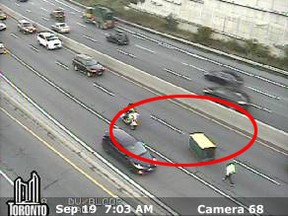 Traffic cameras should a portable toilet laying in the middle southbound lane of the Don Valley Parkway before the Bayview-Bloor offramp.