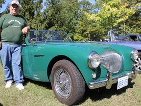Dan Moore with the Bluewater Austin-Healey Club, stands by a 1956 Austin-Healey 100-4, near his Rutherglen Close home in Sarnia. Club members are hosting their fifth annual Invade the Close car show and fundraiser for the Salvation Army Saturday. (TYLER KULA, The Observer)