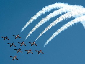 Canada's elite aerobatics team, the Snowbirds, perform in the sky above the International Plowing Match near Mitchell, on Thursday, Sept. 19, 2013.