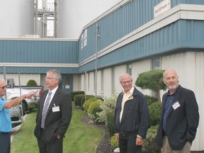 Angelo Ligori, left, plant manager of the GreenField Ethanol facility, speaks with Gary Goodyear, Minister of State for the Federal Economic Development Agency for Southern Ontario during his visit to Chatham on Sept. 19. At right are Lambton-Kent-Middlesex MP Bev Shipley and Chatham-Kent-Essex MP Dave Van Kesteren, who accompanied Goodyear.