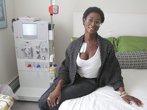 Karen Nicole Smith, who undergoes dialysis treatment five times a week in her home, sits in her Kingston apartment next to the dialysis machine. 
Michael Lea The Whig-Standard