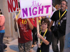 Aiden Frais, 10, was among nearly 100 people walking in the 20th annual Take Back the Night march in Sarnia Thursday. The demonstration serves as a rallying cry against violence against women. TYLER KULA/ THE OBSERVER/ QMI AGENCY