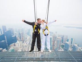 Lacy Boland and John Kirk wed on the CN Tower Edgewalk Thursday, Sept. 19, 2013. (Supplied)