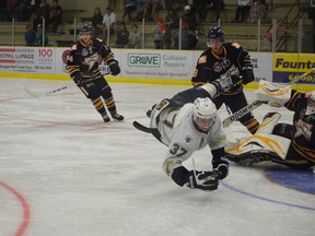 The Spruce Grove Saints were crashing the net hard against the Grande Prairie Storm on Sept. 14, but Storm goaltender Nick Kulmanovsky was able to thwart this attempt by Rylan Yaremko (37). Goals were scored by Dylan Hollman and Parker Mackay as the Saints took the game 3-1. - Thomas Miller, Reporter/Examiner