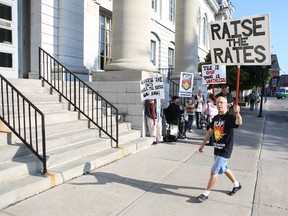 Ron Nelson of the Kingston Coalition Against Poverty pickets in front of Kingston City Hall to protest consultations about the province's poverty reduction strategy.
Elliot Ferguson The Whig-Standard