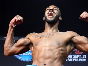 Jon (Bones) Jones clearly likes what he sees at the UFC 165 weigh-ins on Friday. (Dave Abel/Toronto Sun)