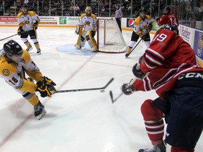 Sarnia forward Bryan Moore attempts to block an Oshawa Generals pass during the second period of the Sting home opener on Friday, Sept. 20. Oshawa scored with 12 seconds left to beat Sarnia 5-4. SHAUN BISSON/THE OBSERVER/QMI AGENCY