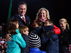 Republican presidential nominee Mitt Romney and his wife Ann welcome some of their grandchildren onstage at a campaign rally in West Chester, Ohio November 2, 2012. On right is Republican vice-presidential nominee Paul Ryan's wife Janna. REUTERS/Brian Snyder