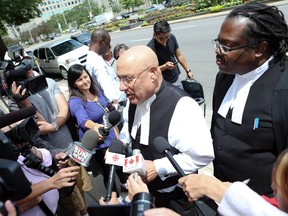 Lawyer Peter Rosenthal,in a scrum along Unversity Ave on Friday, July 12, 2013, in Toronto. He is the lawyer for  three citizens who argued in court that forcing new Canadians to pledge allegiance to the Queen is discriminatory and a violation of constitutional rights.  (Veronica Henri/Toronto Sun files)