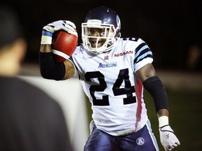 Argos' Alonzo Lawrence is all smiles after recovering the Stampeders' last-play kick into the Toronto end zone, sealing the Boatmen's victory on Saturday night in Calgary. (Mike Drew, QMI Agency)