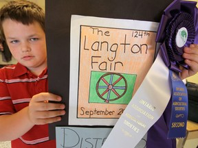 Colton Butler shows off his prize-winning fair promotional poster that took second place provincially in the 2012 Ontario Association of Agricultural Societies competition. He’ll be looking to defend his Langton Fair title at that popular area tradition continues for its 125th year this Wednesday (September 25) at the Langton Arena and Sports Complex. Jeff Tribe/Tillsonburg News